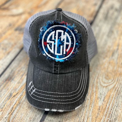 Black Distressed Trucker hat with the SCA embroidered on a raggy patch.