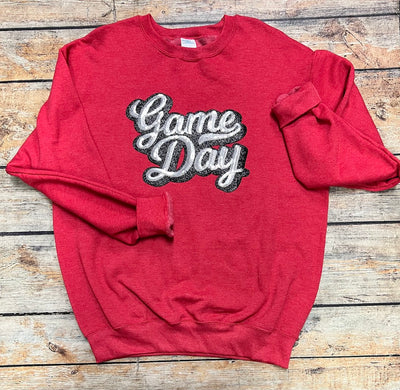 Sequence game day patch in silver and black on red sweatshirt