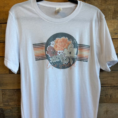 White shirt with floral design on a wooden surface