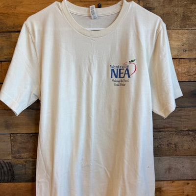 White t-shirt with a logo on a wooden surface
