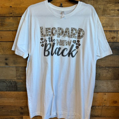 White tshirt with text on a wooden surface