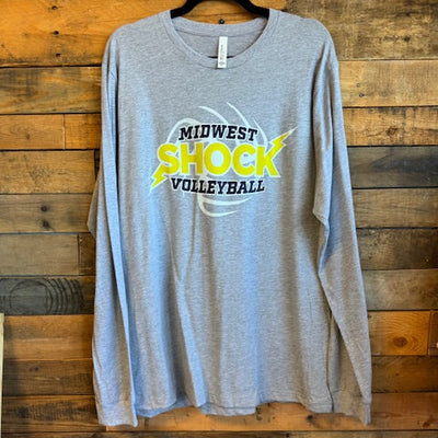 Gray t-shirt with 'Midwest Shock Volleyball' logo on a wooden surface