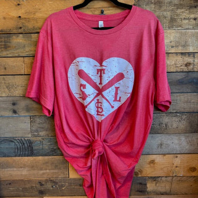 Red tshirt with a white graphic on a wooden surface