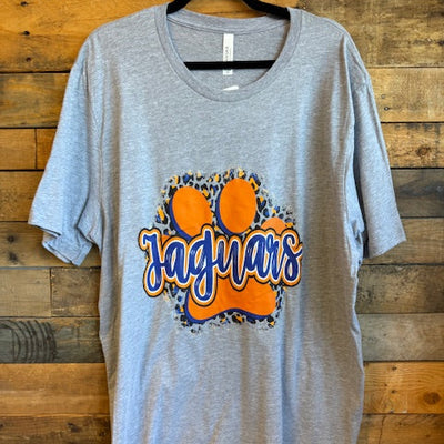 Gray tshirt with orange and blue 'Jaguars' logo on a wooden background
