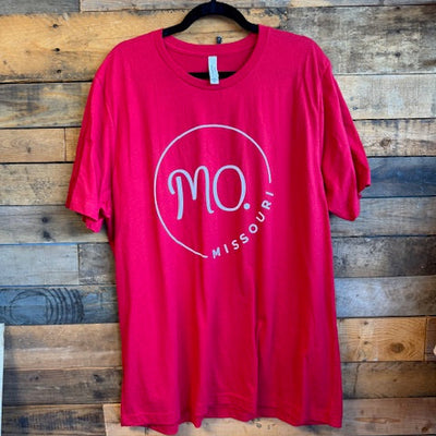Red t-shirt with 'Missouri' print on a wooden surface