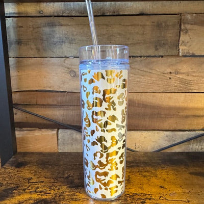 Tumbler with a pattern on a wooden surface