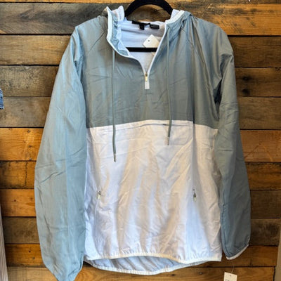white and grey jacket on a wooden surface