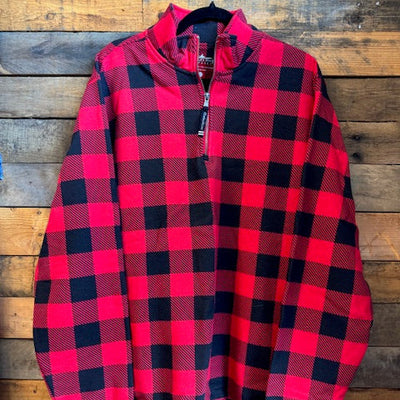 red and black plaid shirt on a wooden surface