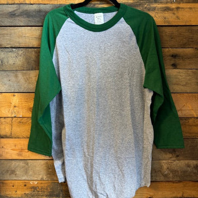 gray and green shirt on a wooden surface