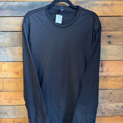 Black t-shirt on a wooden surface