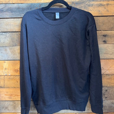 black ladies crewneck sweatshirt on a wooden surface