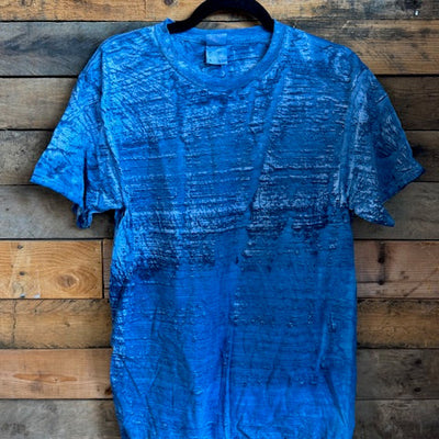 Blue tshirt on a wooden surface