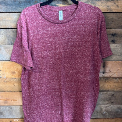 Maroon t-shirt on a wooden surface