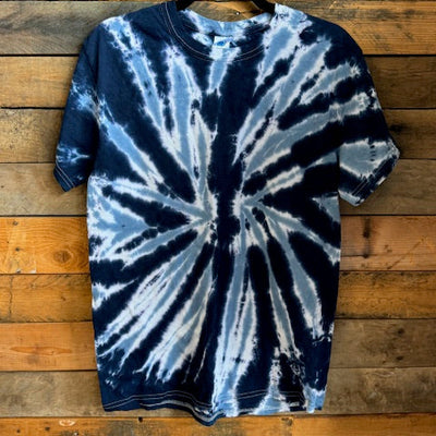 Tie-dye hoodie on a wooden surface