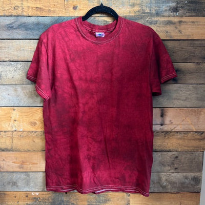 red t-shirt on a wooden surface