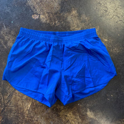 Blue shorts on a textured dark surface