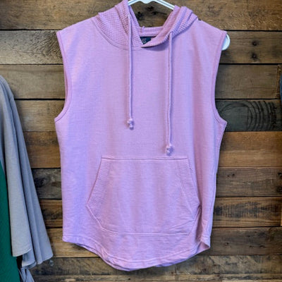 purple sweatshirt on a wooden surface