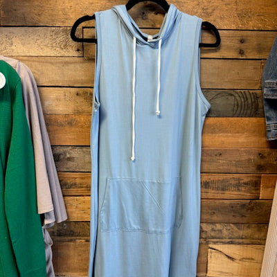 light blue dress on a wooden surface