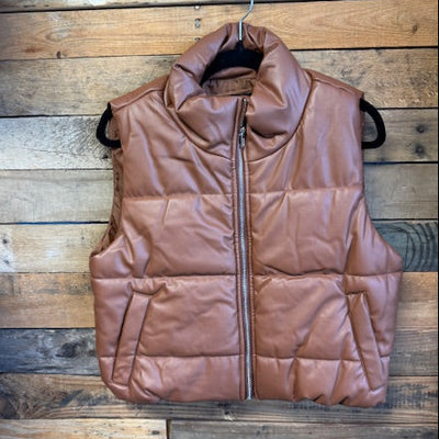 Brown puffer jacket on a wooden surface