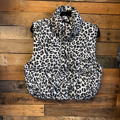 Leopard print vest on a wooden surface