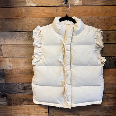 White puffer jacket on a wooden door