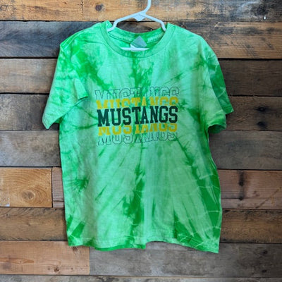 Green tie-dye t-shirt with 'Mustangs' text on a wooden surface
