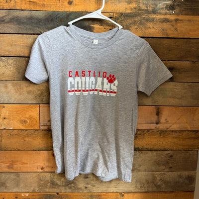 Gray t-shirt with red and white text on a wooden surface