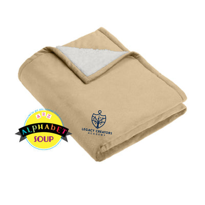 Camel blanket with sherpa lining featuring 'Legacy Creators Academy' embroidered logo.