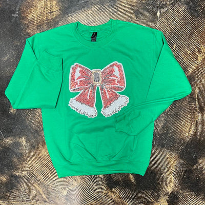 Green sweatshirt with a large sequin santa bow patch
