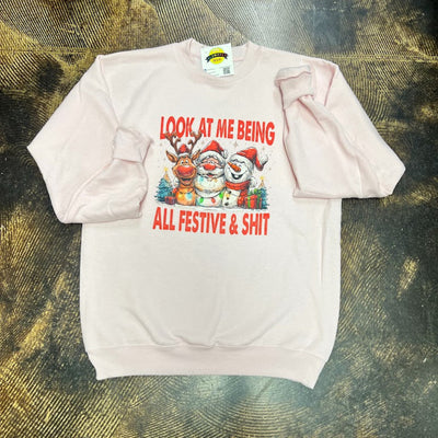 pink sweatshirt with Christmas-themed graphic