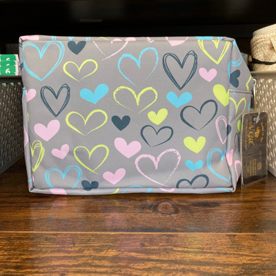 Fabric storage bag with heart pattern on a wooden surface