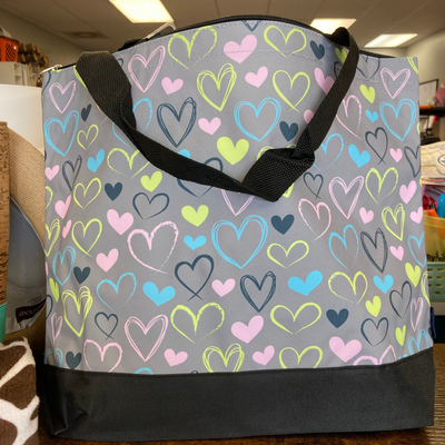 Gray tote bag with colorful heart pattern 