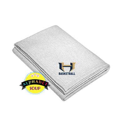 sweatshirt blanket with holt basketball logo embroidered on the corner