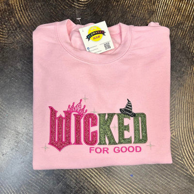Pink sweatshirt with 'Wicked for Good' embroidered glitter design