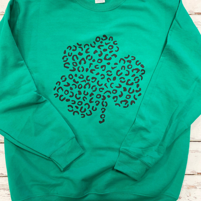 green crewneck sweatshirt with leopard shamrock
